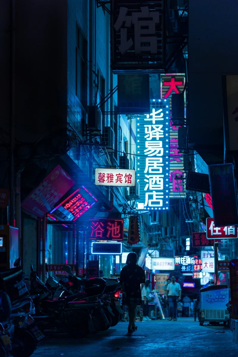 Cyberpunk neon street at night with people walking, ultra high definition 4K AMOLED mobile wallpaper with vivid colors and crisp detail