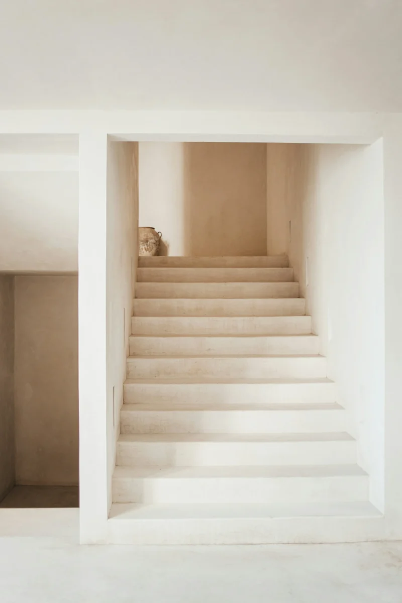 Minimalist white concrete staircase 4K mobile AMOLED wallpaper with crisp geometric lines and high contrast architectural aesthetic