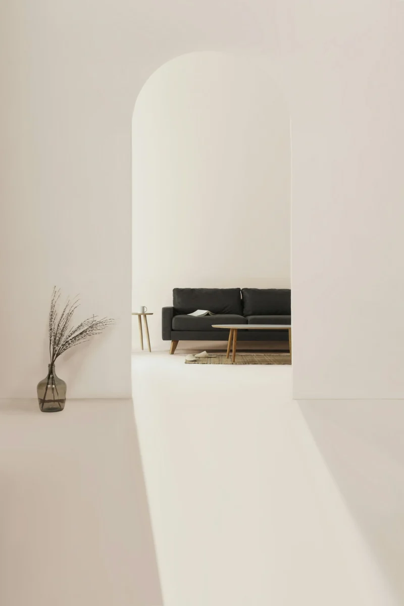 Minimalist black and brown leather padded tub sofa wallpaper in 4K resolution with crisp detail for mobile AMOLED screens.