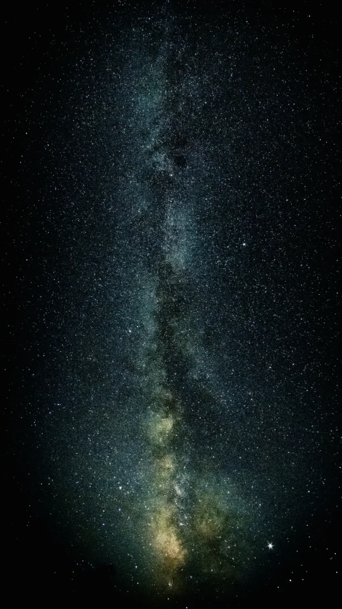 Vibrant Milky Way galaxy and starry night sky with vivid purple and blue nebulae, ultra HD 4K mobile AMOLED wallpaper.