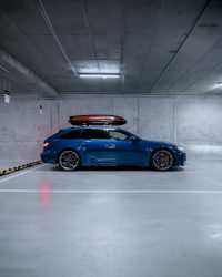 a blue car parked in a parking garage
