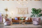 brown leather sofa and two pink sofa chair wallpaper