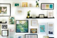 assorted-color framed paintings on the wall home design